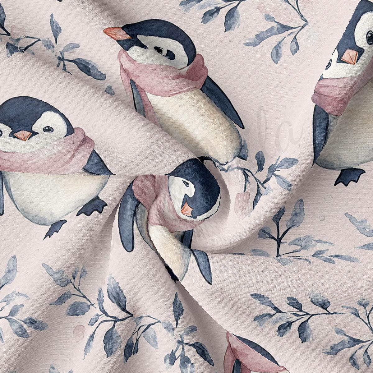 a close-up view of a fabric with a repeating pattern of penguins wearing pink scarves and surrounded by leaves.
