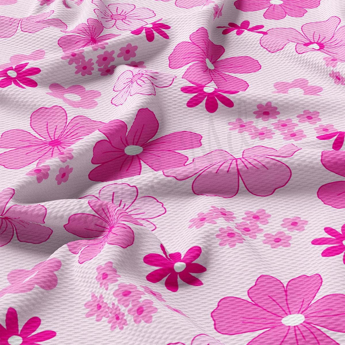 a close up of a pink flowered fabric