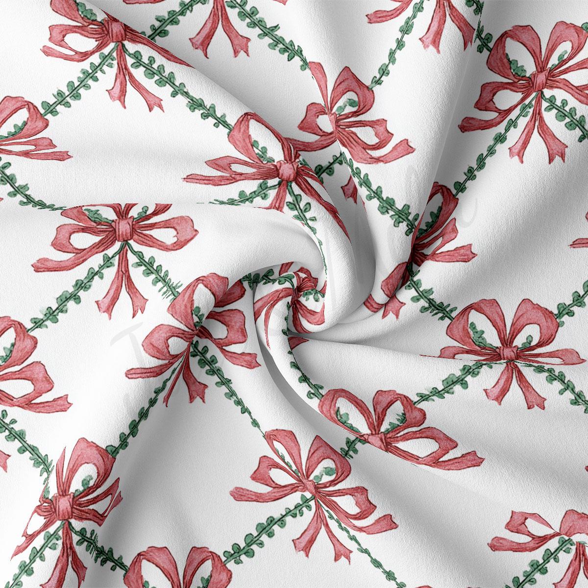 a close-up view of a fabric with a repeating pattern of red bows and green leaves. The bows are arranged in a diagonal pattern, creating a sense of movement and dynamism. The fabric appears to be white, providing a contrast to the vibrant colors of the bows and leaves. The image does not contain any text or other discernible objects, and the relative positions of the bows and leaves remain consistent throughout the pattern.