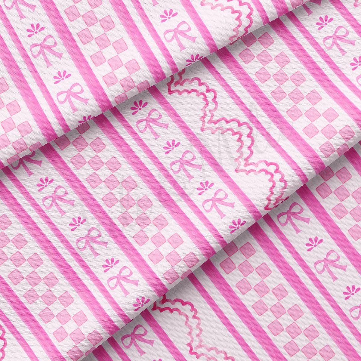 a pink and white striped fabric with a pattern