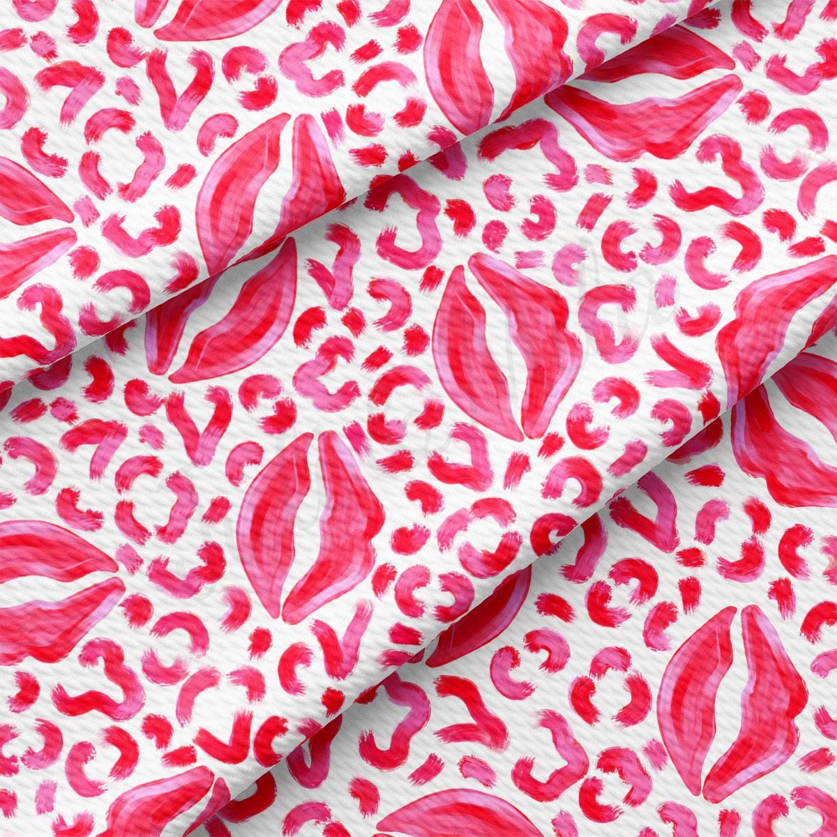 a red and white fabric with a pattern of hearts