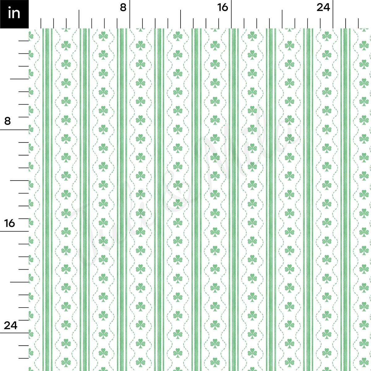 a green and white striped ruler with shamrocks on it