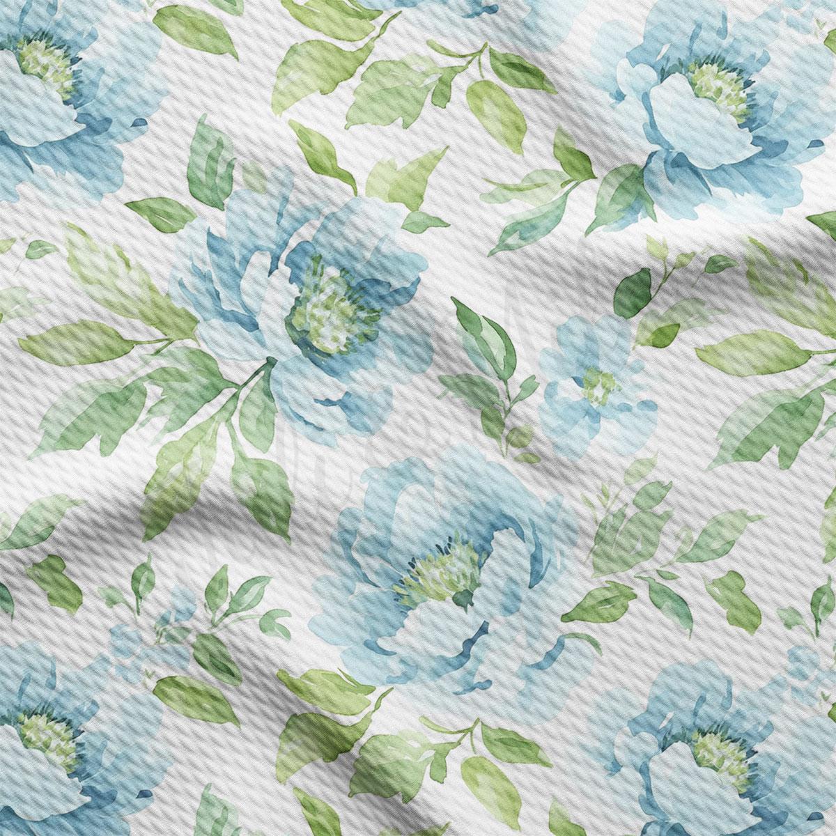 a repeating pattern of blue flowers with green leaves on a white background.