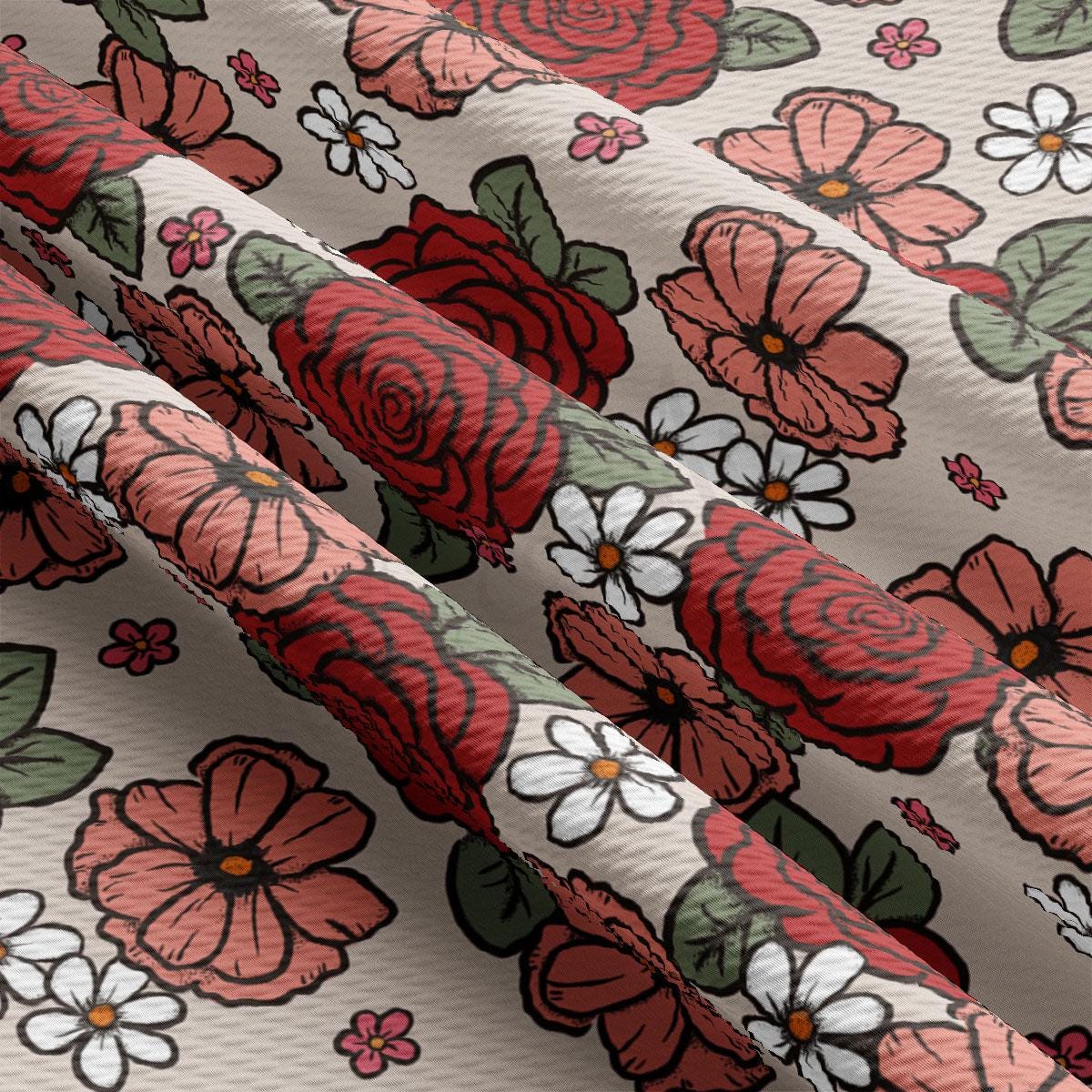 a close up of a flowered fabric with red and white flowers