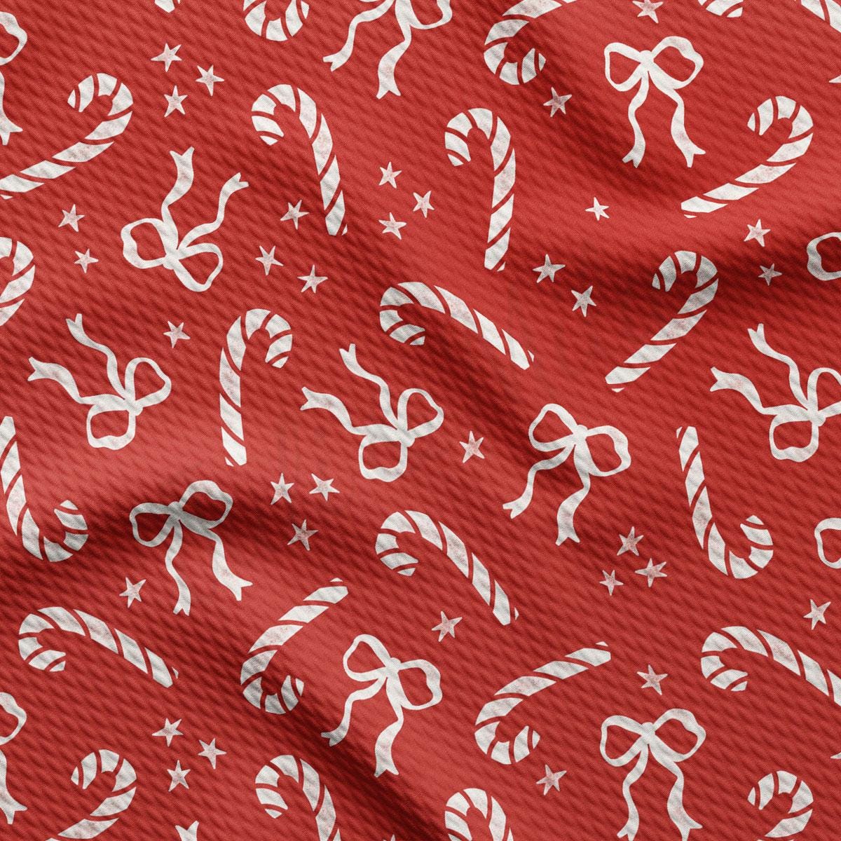 a red background with white candy canes and stars