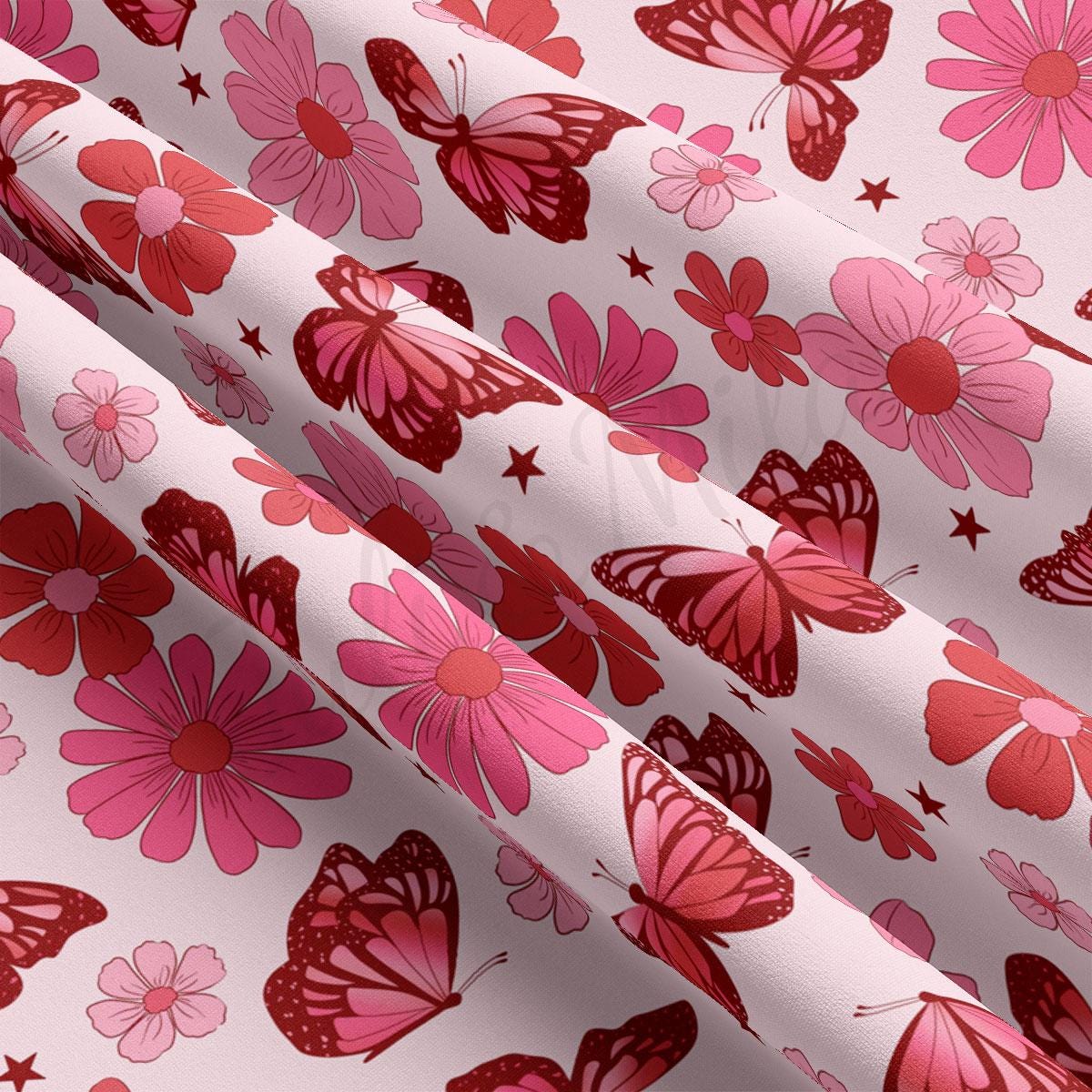 a pink and red flower and butterfly print fabric