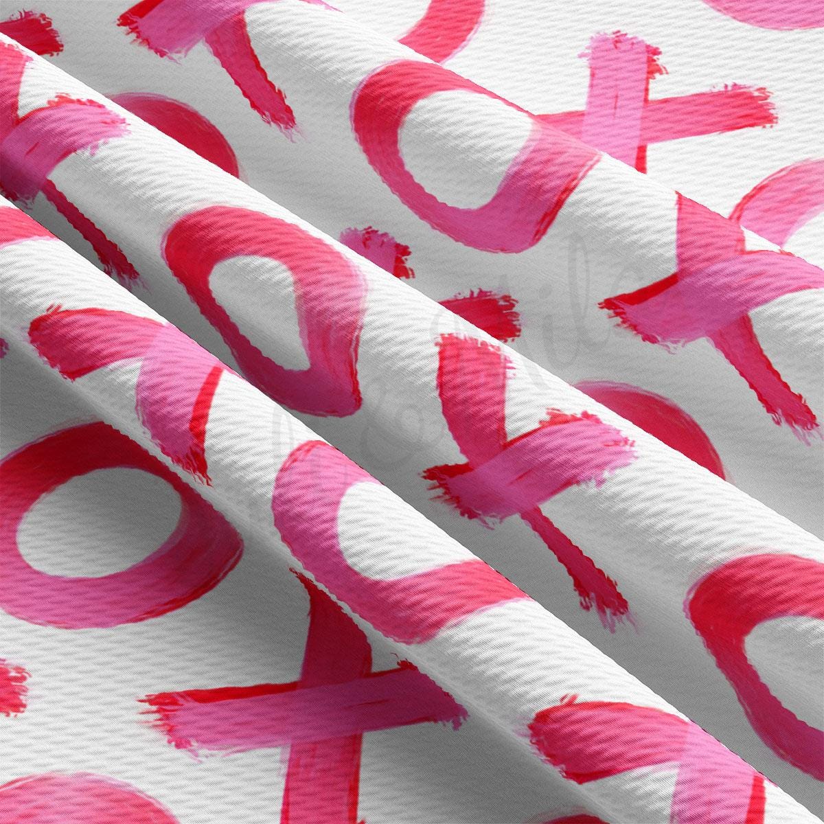 a close up of a pink and white wallpaper