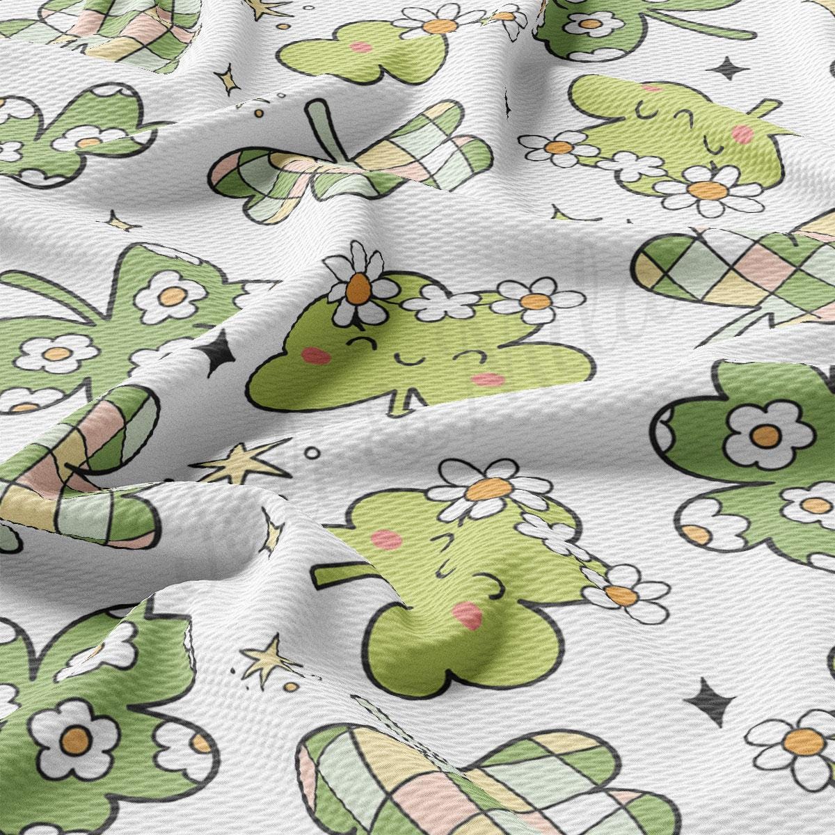 a close up of a green and white pattern on a fabric