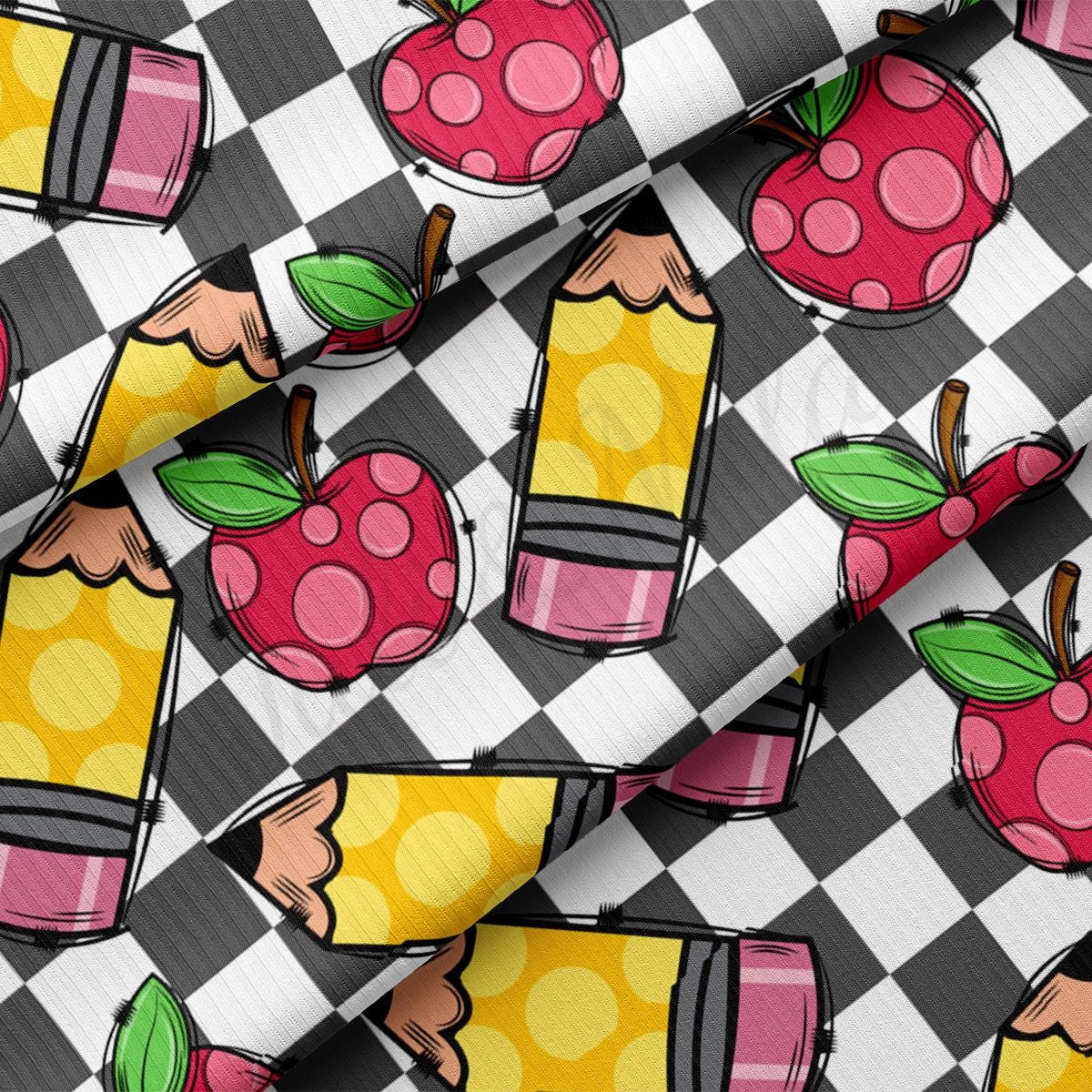 a close up of a tie with an apple on it