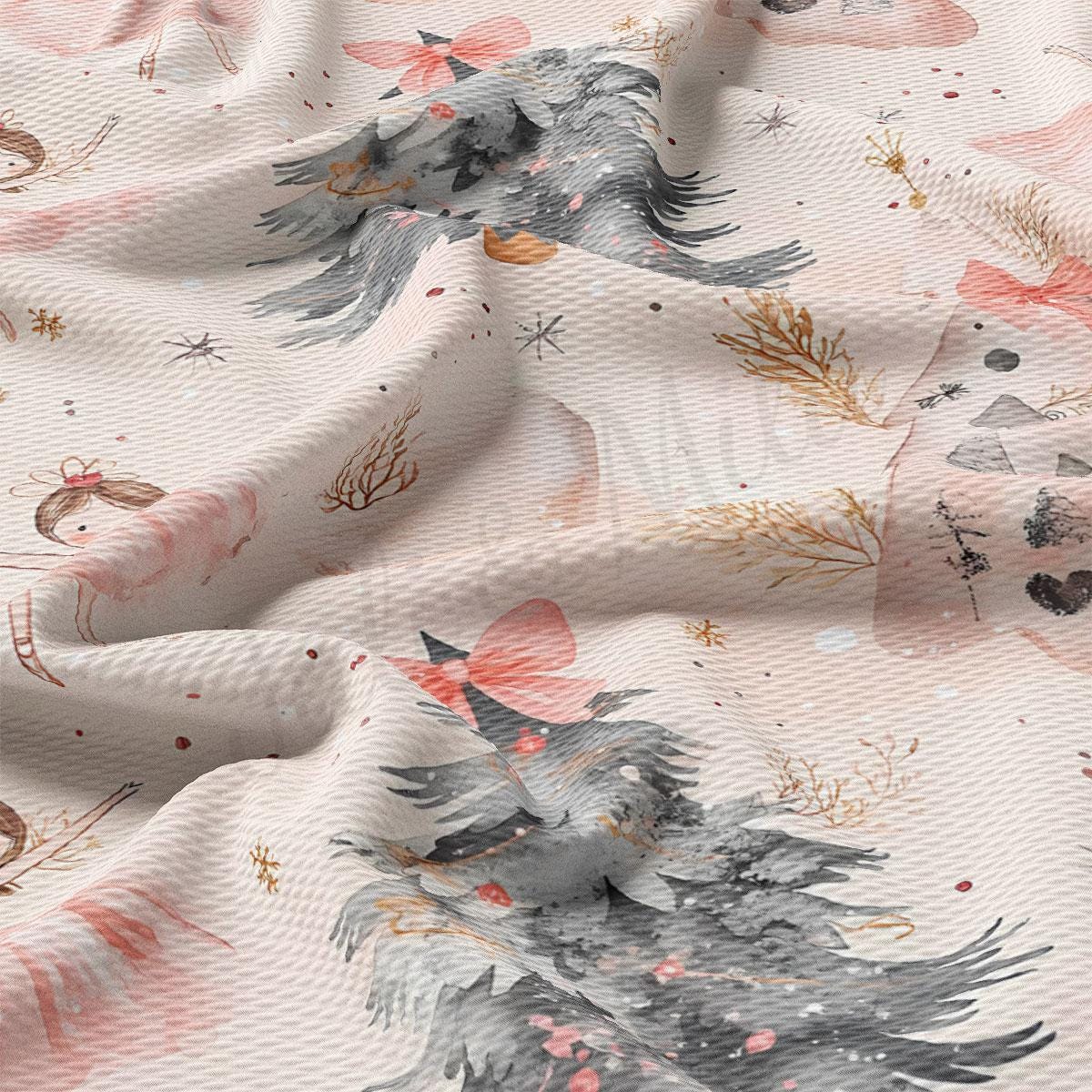 a close-up view of a fabric with a repeating pattern of Christmas trees and other festive elements, such as snowflakes and stars, in shades of pink, gray, and gold.