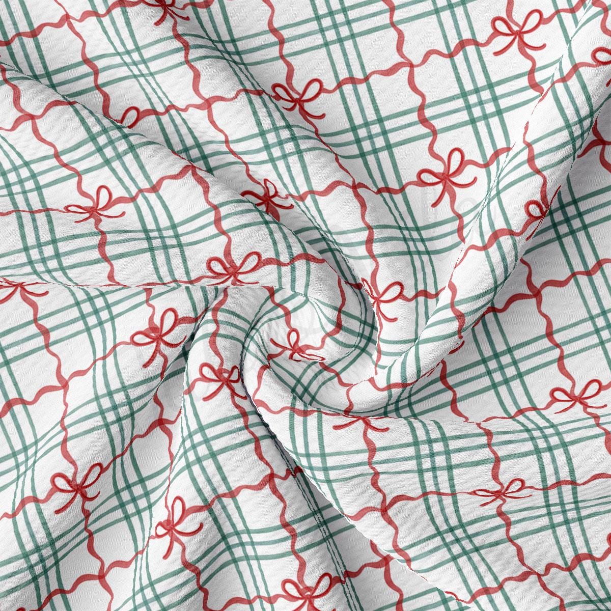 a close-up view of a fabric with a repeating pattern of green and red checkered lines and red bows.