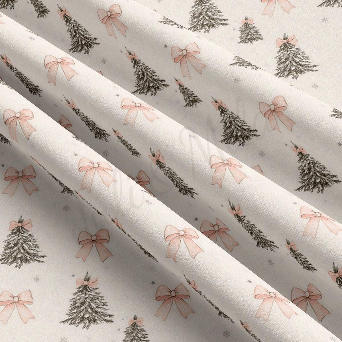 a fabric with a repeating pattern of Christmas trees and pink bows.