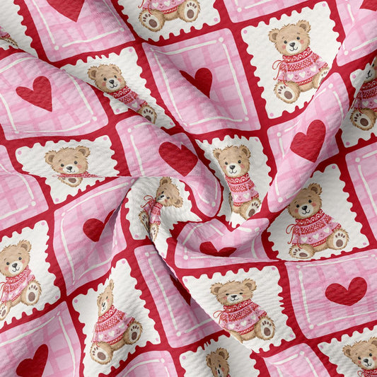 a fabric with a repeating pattern of pink and white teddy bears wearing red sweaters, along with red hearts.