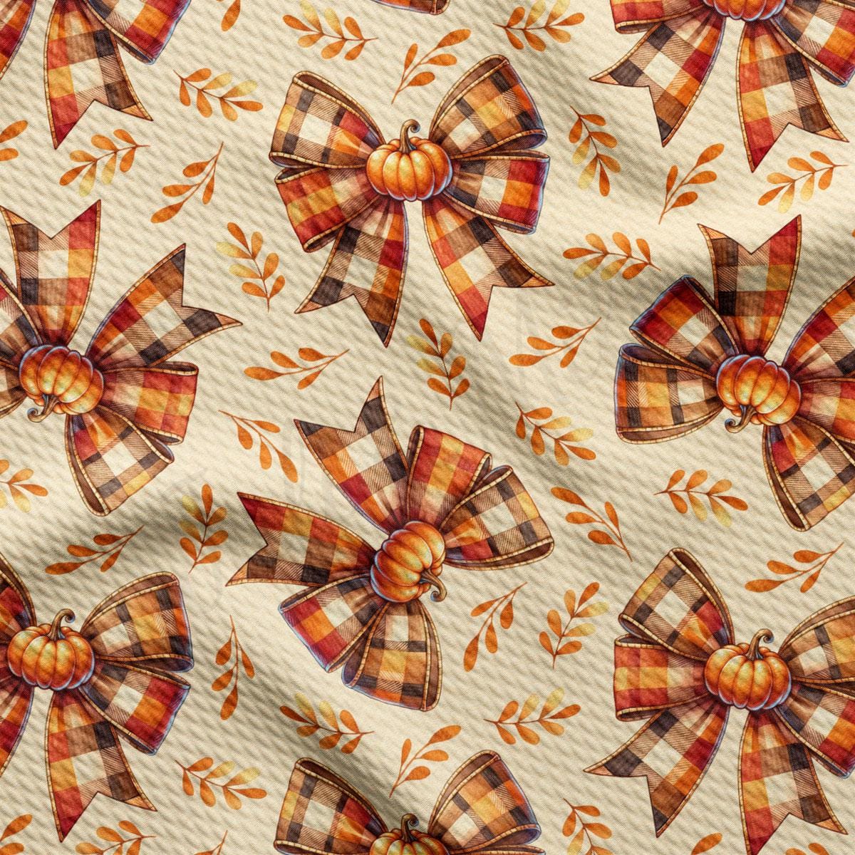 a repeating pattern of plaid bows and pumpkins, creating a festive and autumnal design.