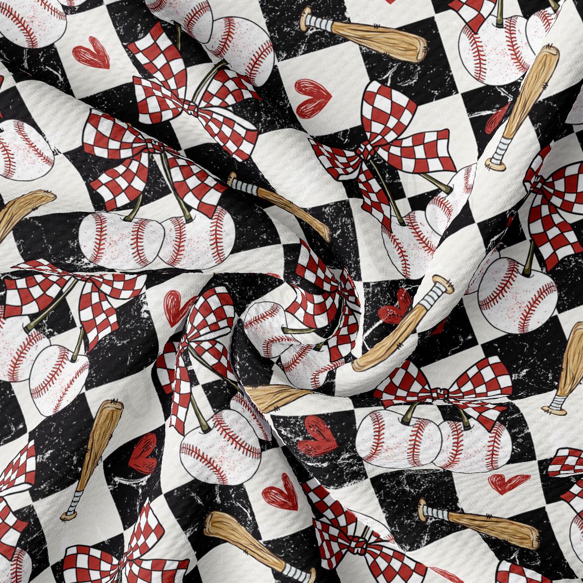 The image is a close-up of a fabric with a repeating pattern of baseballs, bats, and hearts on a black and white checkered background.