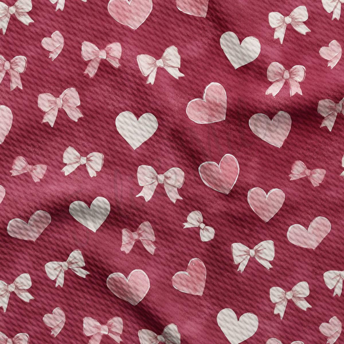 a close-up view of a fabric with a repeating pattern of white hearts and bows on a maroon background.