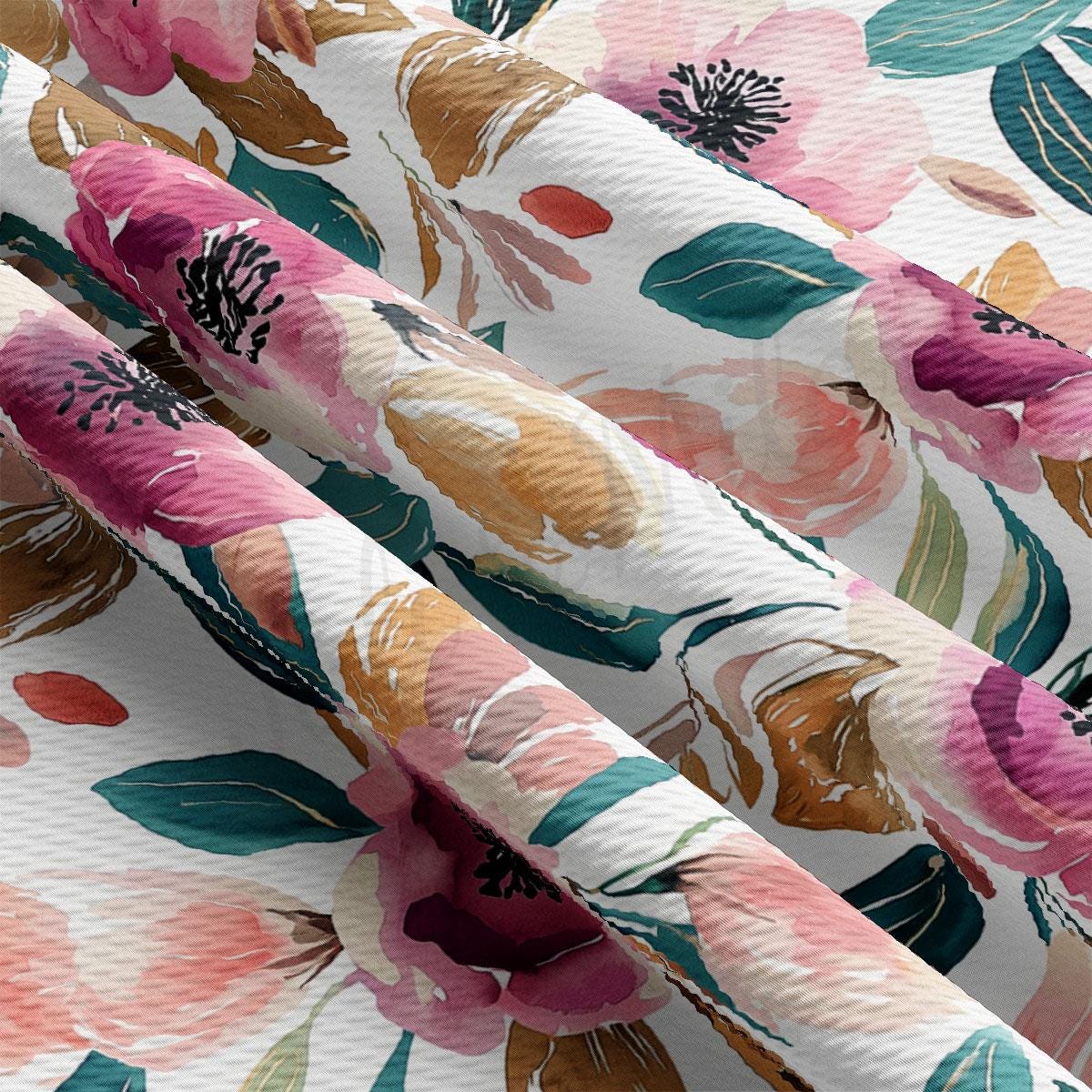a close-up view of a fabric with a vibrant floral pattern. The fabric is adorned with a variety of colorful flowers, including pink, orange, and green, as well as leaves and stems. The flowers are arranged in a way that creates a visually striking and intricate design, showcasing the beauty and diversity of the floral motif.