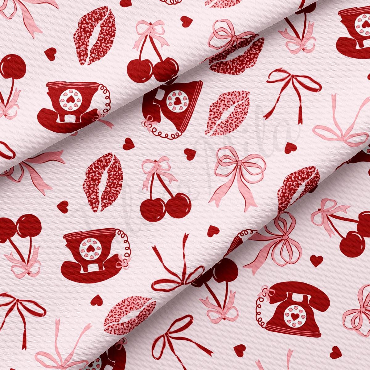 a red and white fabric with cherries on it
