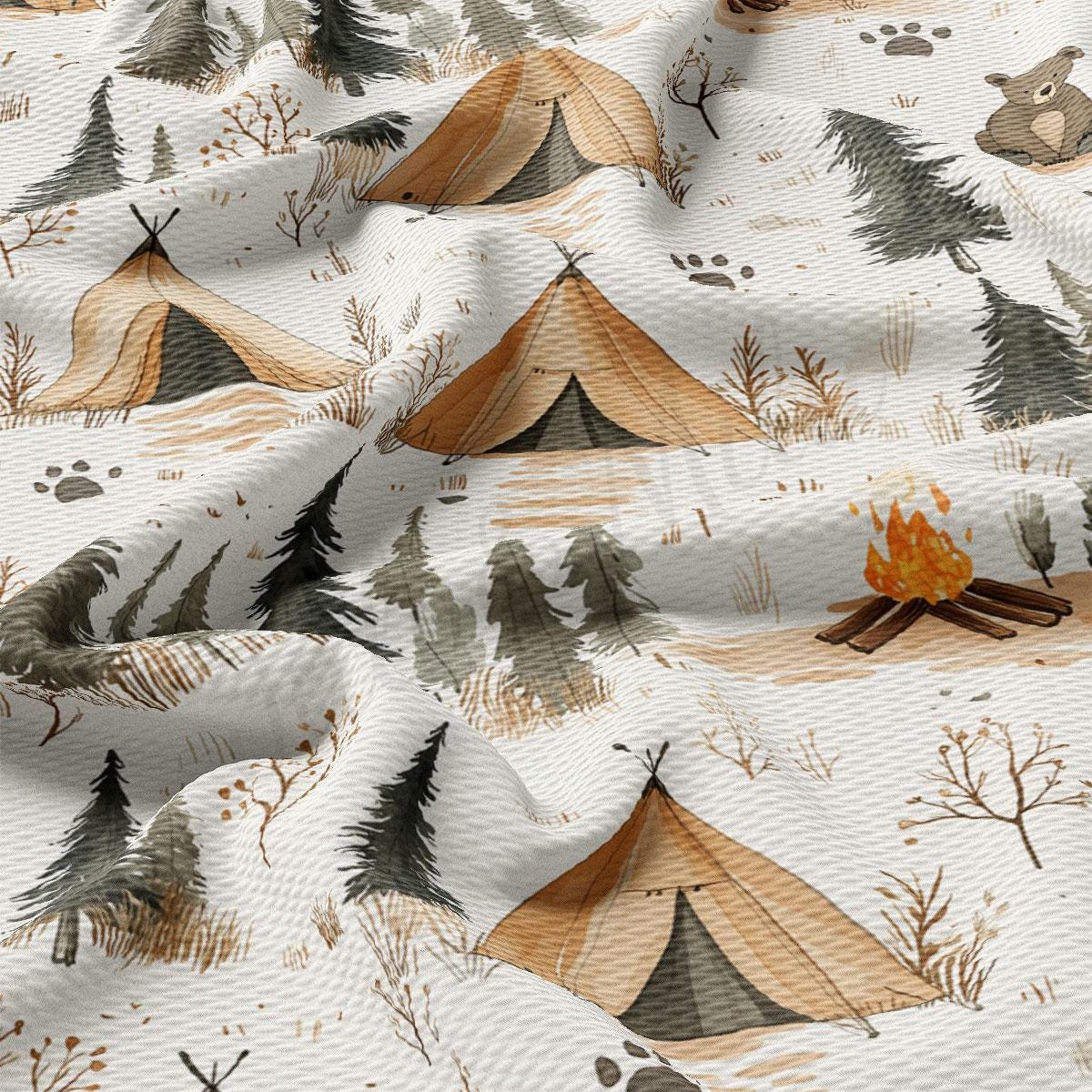 a close-up view of a fabric with a repeating pattern of tents and trees, along with a campfire.