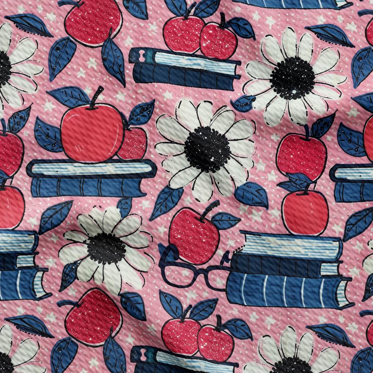 a pink background with red, white, and blue apples and books