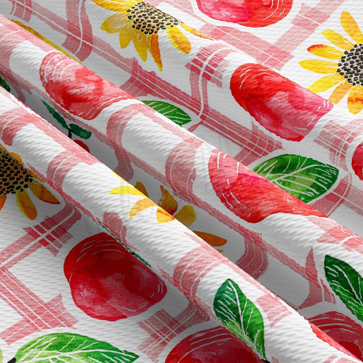 a red and white checkered table cloth with a flower pattern