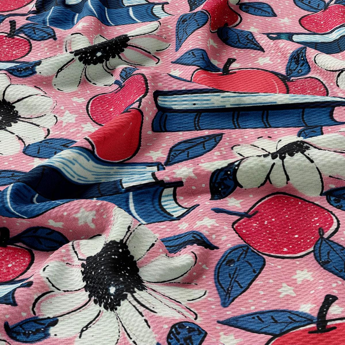 a close up of a pink and blue flowered fabric