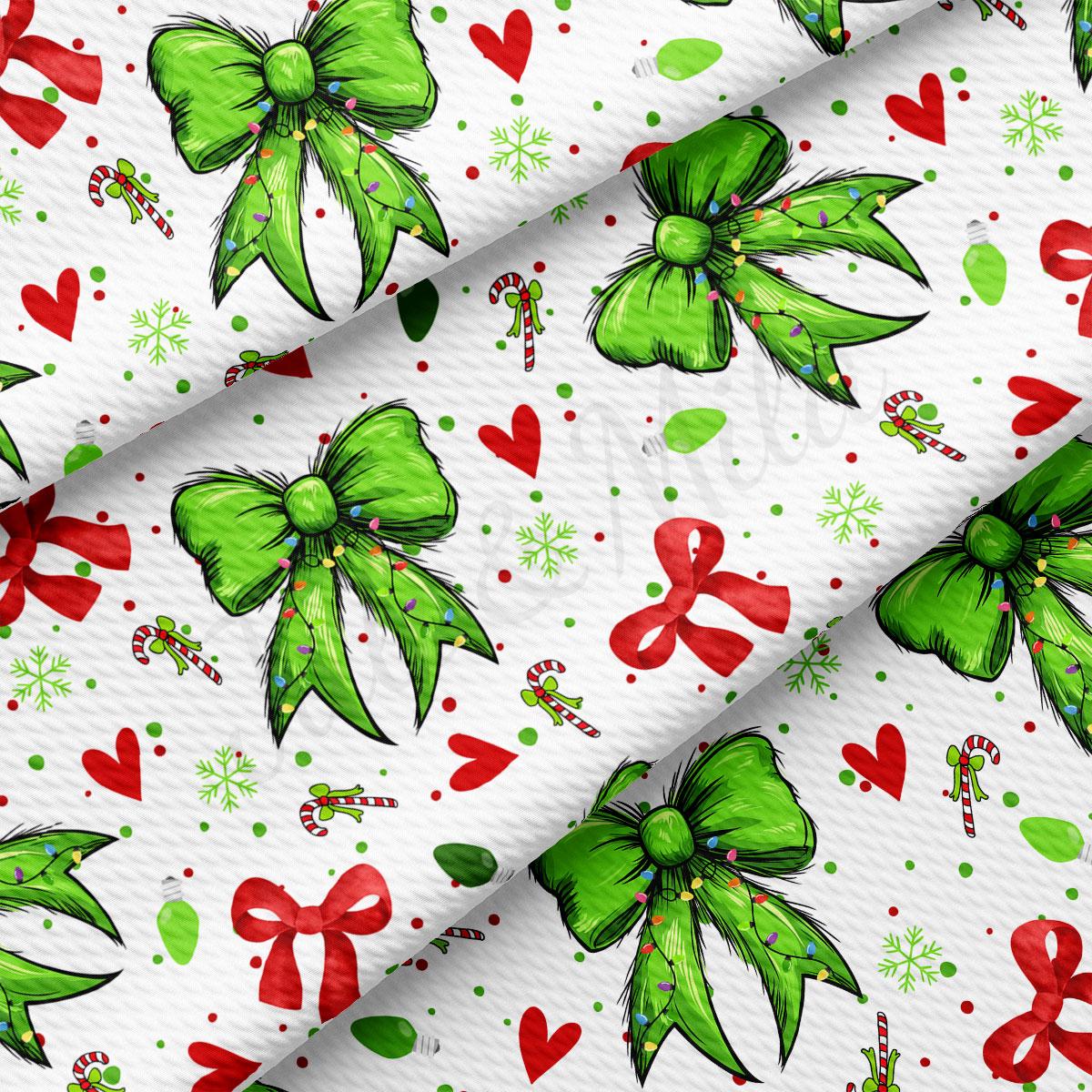 a festive pattern with green bows, red hearts, and candy canes scattered across a white background.