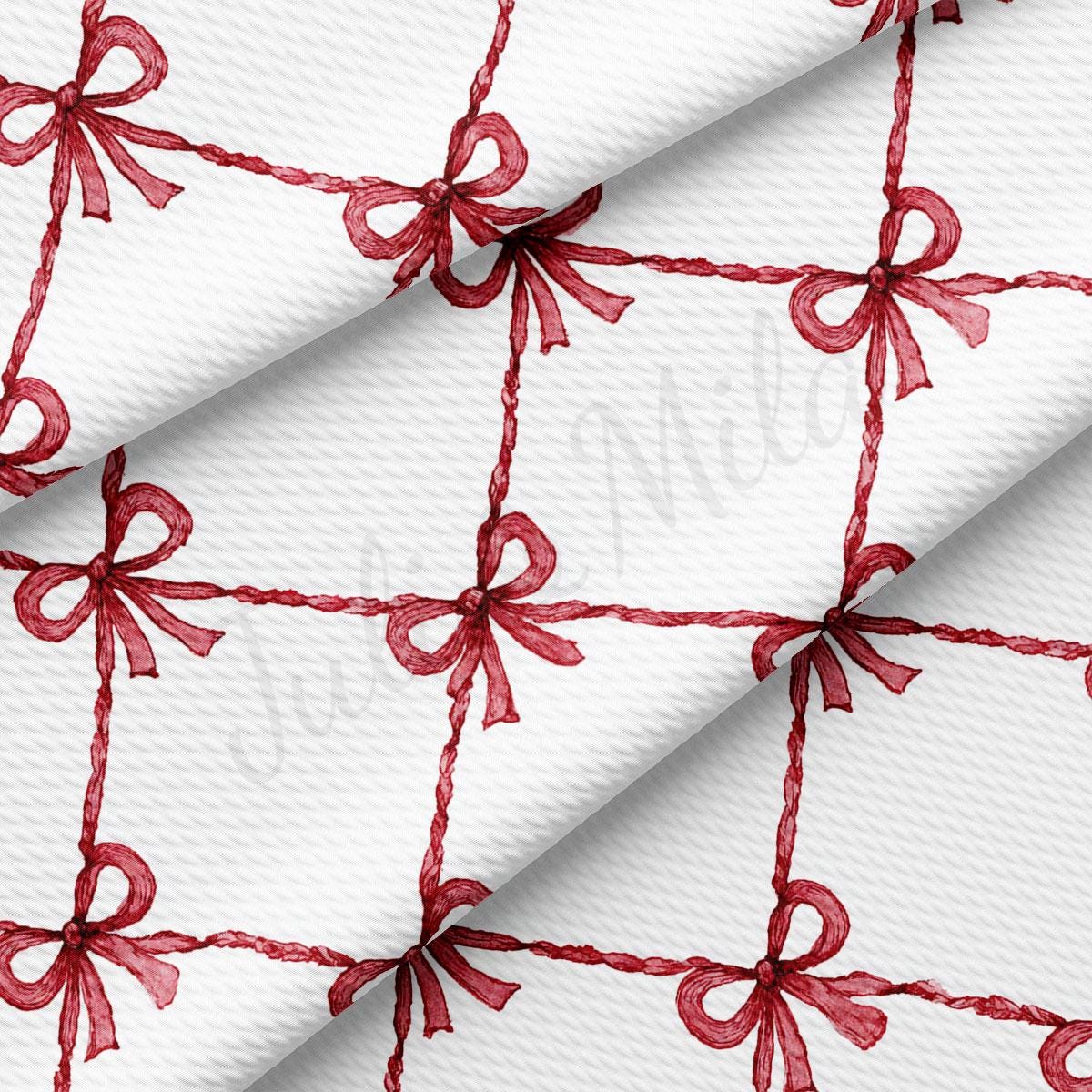 a repeating pattern of red bows on a white background.