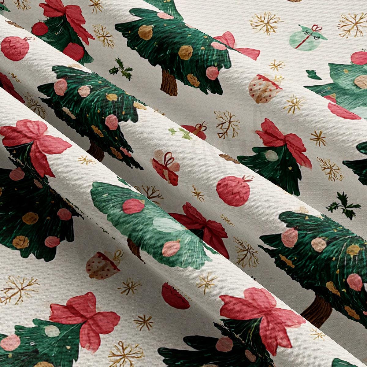 The image is a close-up of a fabric with a repeating pattern of Christmas trees and ornaments, including red bows and gold stars.