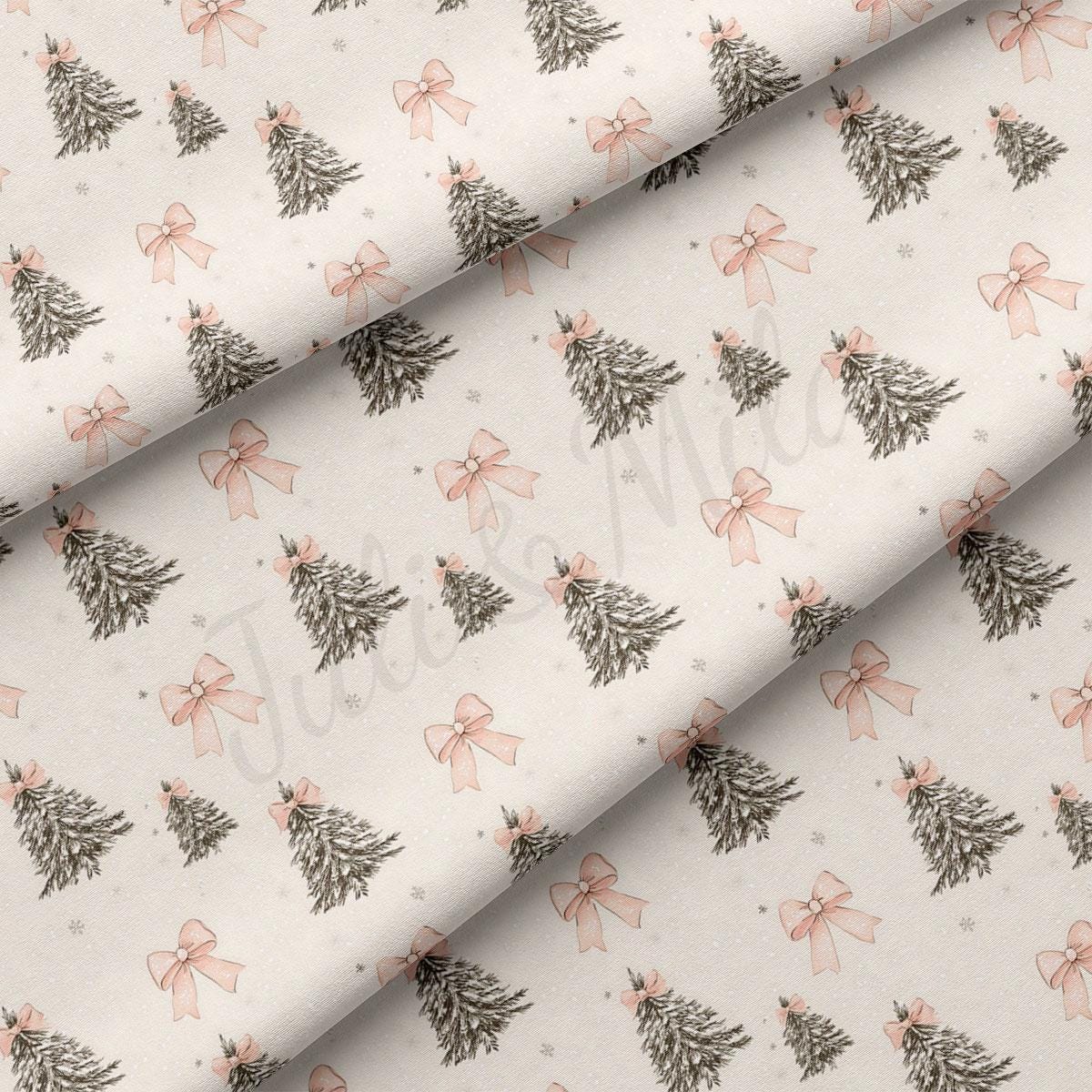 a repeating pattern of Christmas trees with pink bows on a light-colored fabric.
