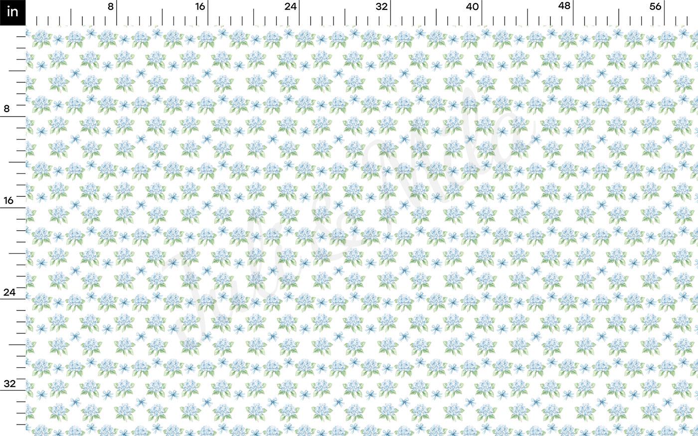 The image is a repeating pattern of small blue flowers on a white background, with a ruler at the top indicating the size of the pattern in inches.