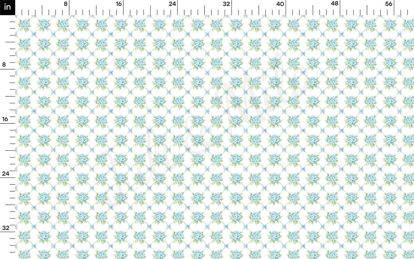 The image is a repeating pattern of blue flowers on a white background, with a ruler for scale at the top.