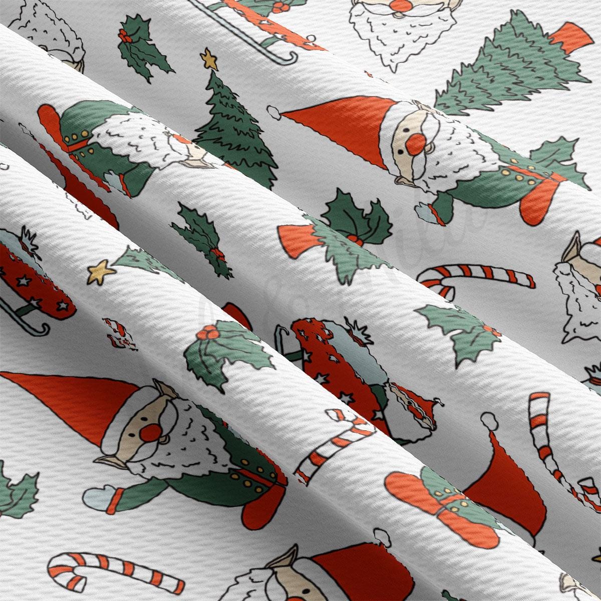 a white christmas wrapping paper with santa claus and christmas trees