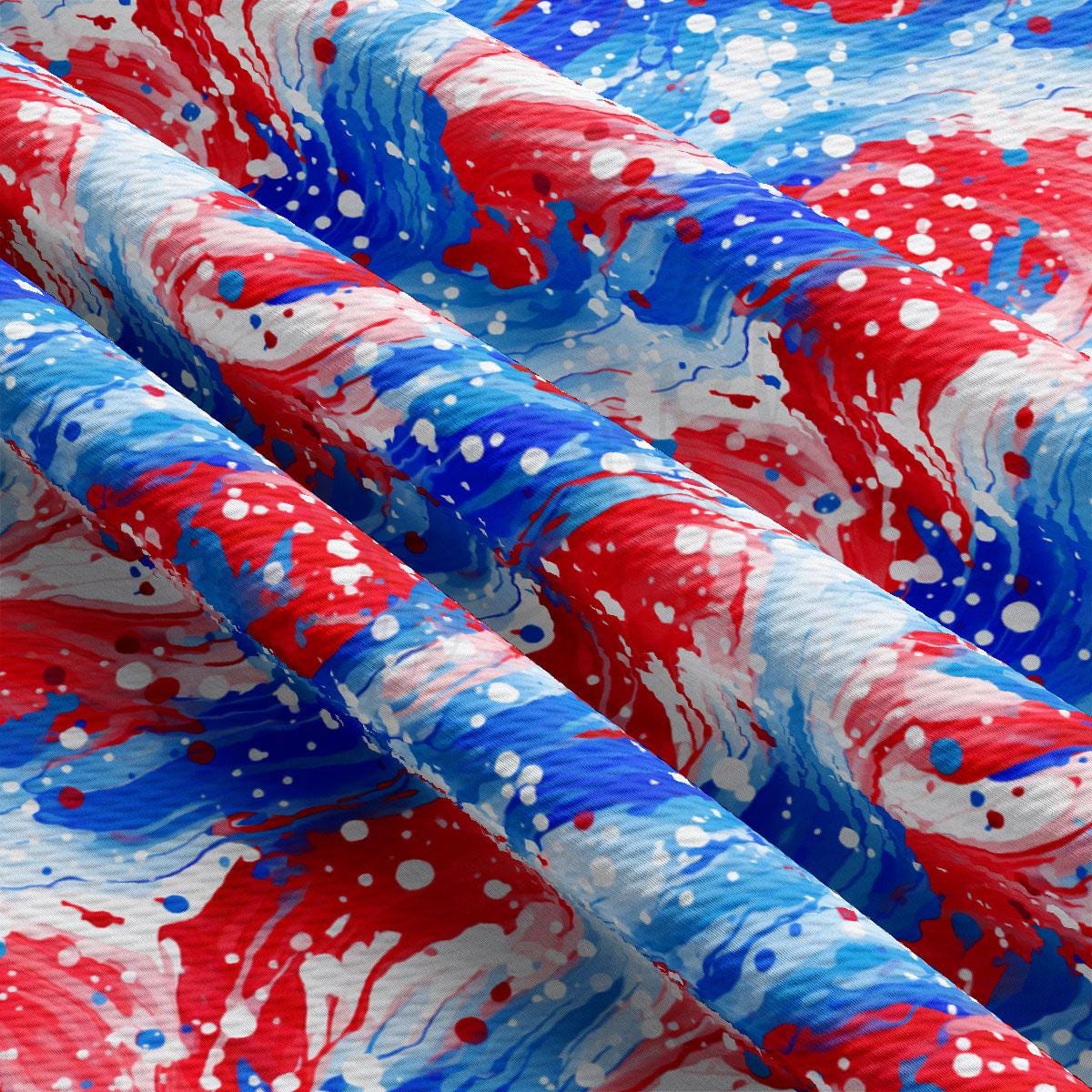 red, white and blue paint splattered on fabric