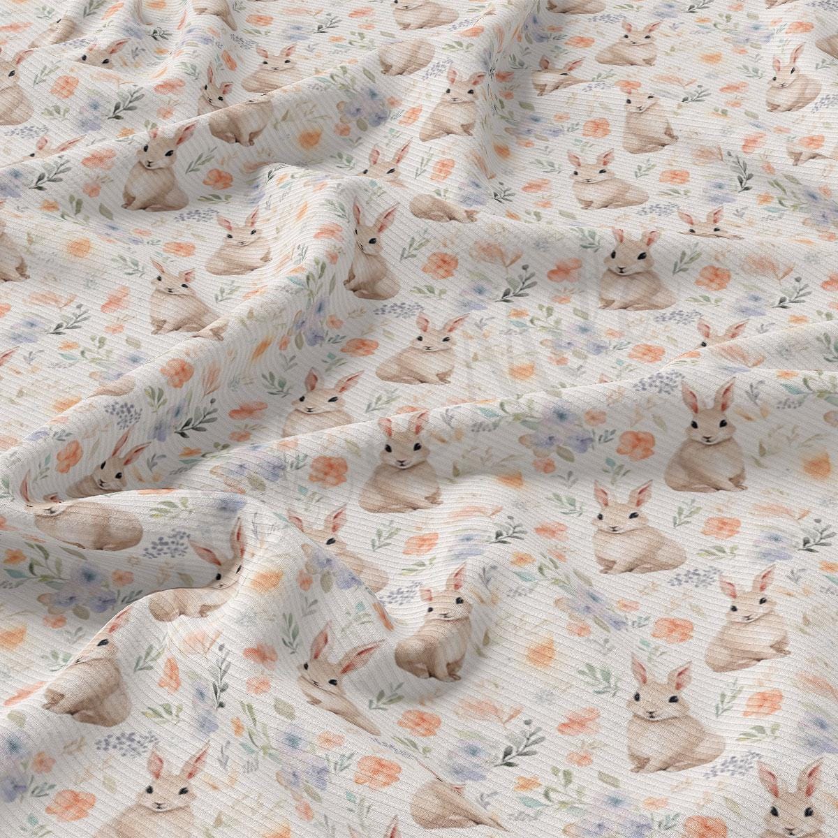 a close up of a sheet with a pattern of rabbits on it