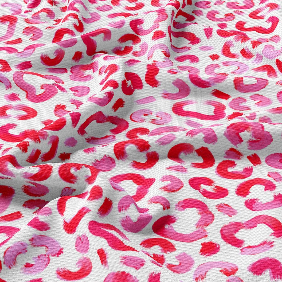a pink and red animal print fabric
