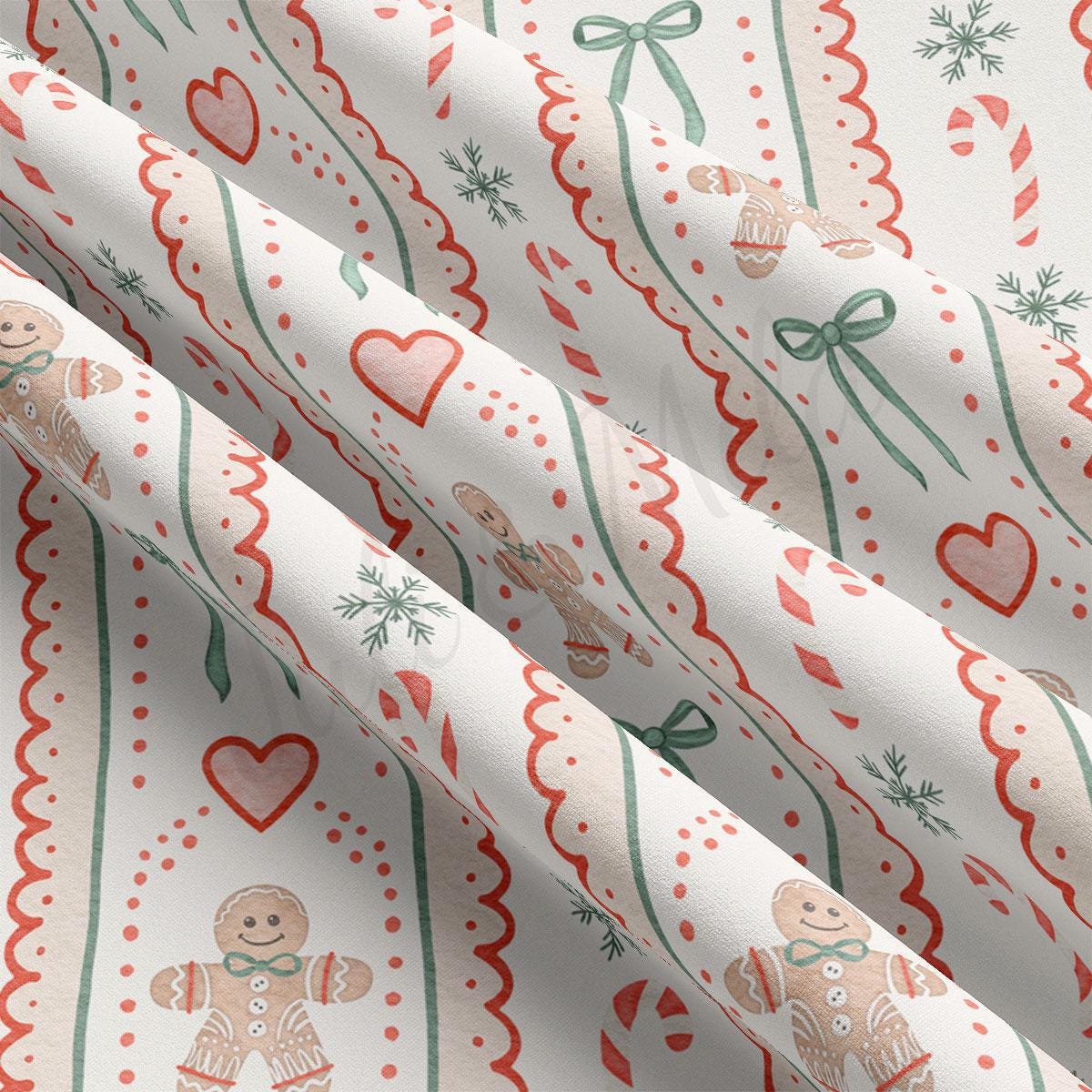 a close-up view of a fabric with a repeating pattern of gingerbread men, hearts, and snowflakes. The pattern is predominantly white with red and green accents, creating a festive and holiday-themed design.