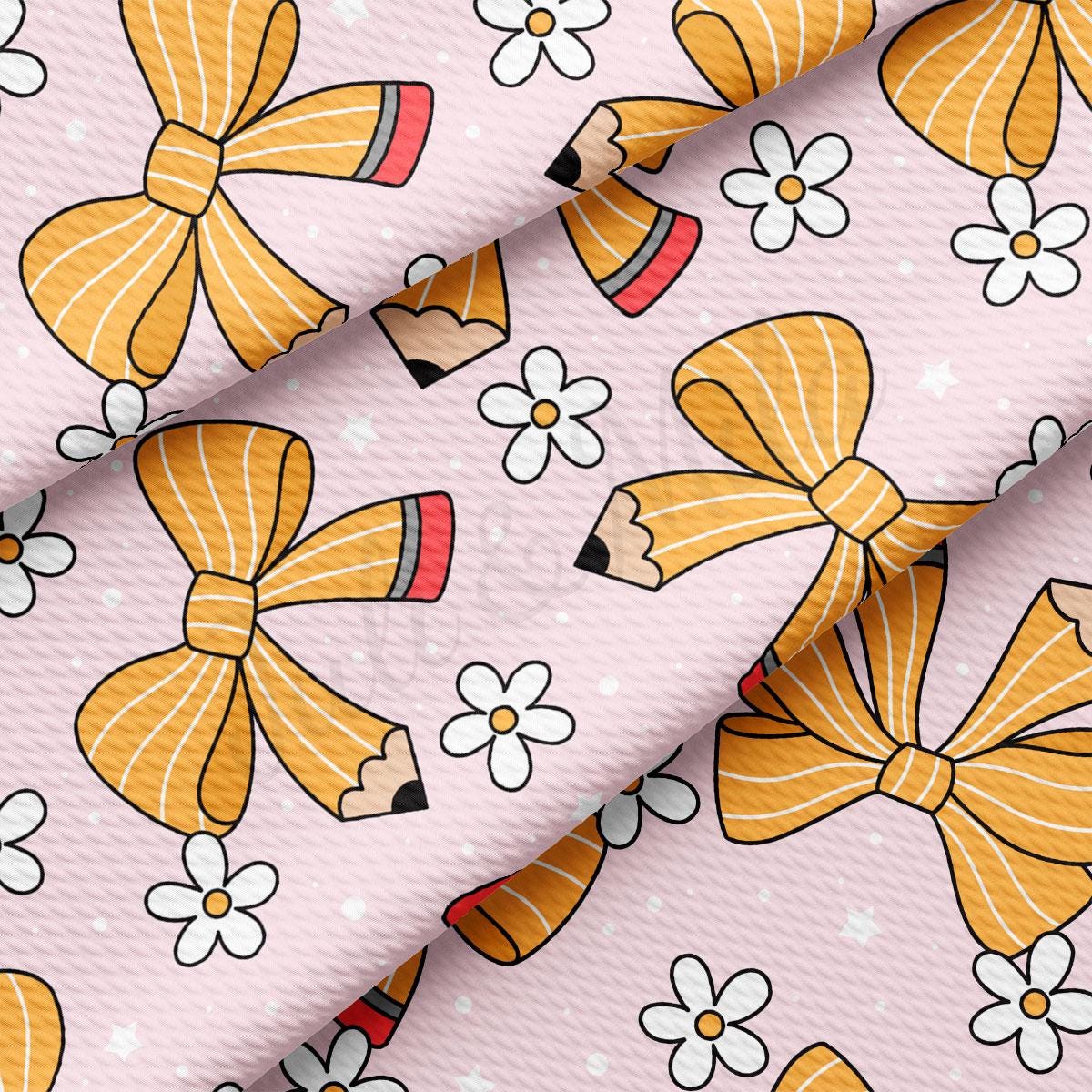 a pink background with yellow bows and white flowers