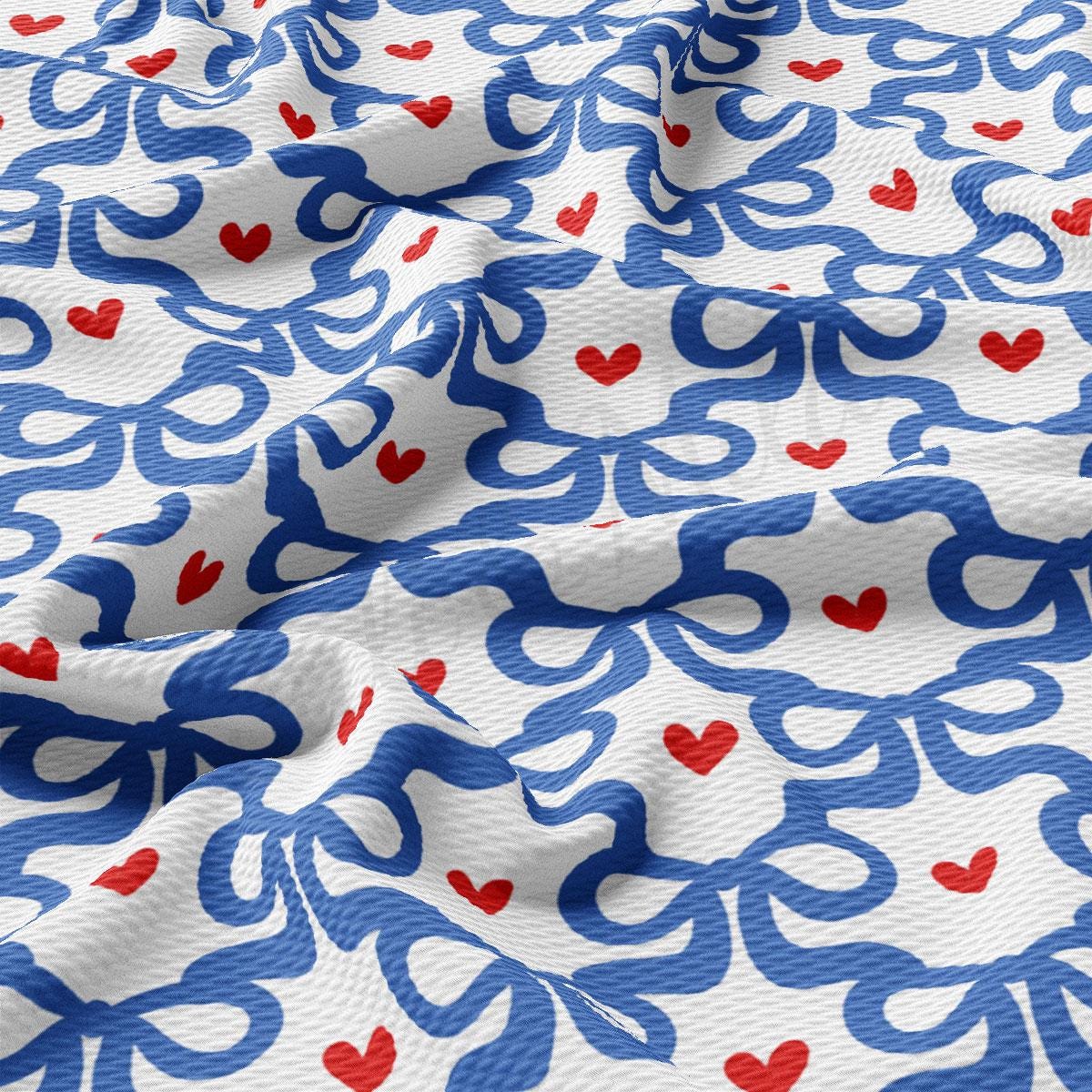a blue and red fabric with hearts on it