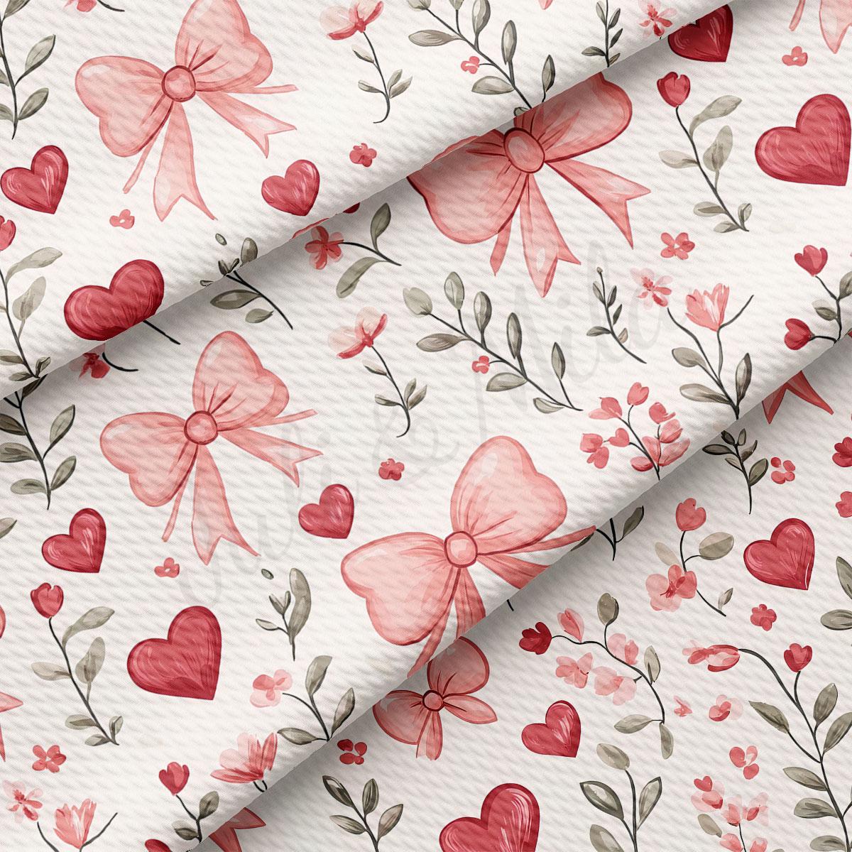 a repeating pattern of pink bows, hearts, and flowers on a white background.