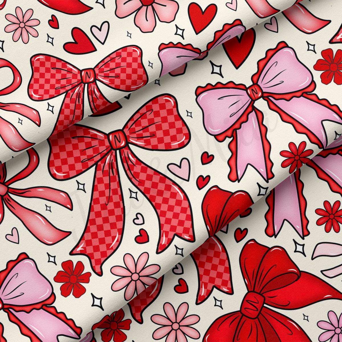 a pattern of red and pink bows, hearts, and flowers on a white background.