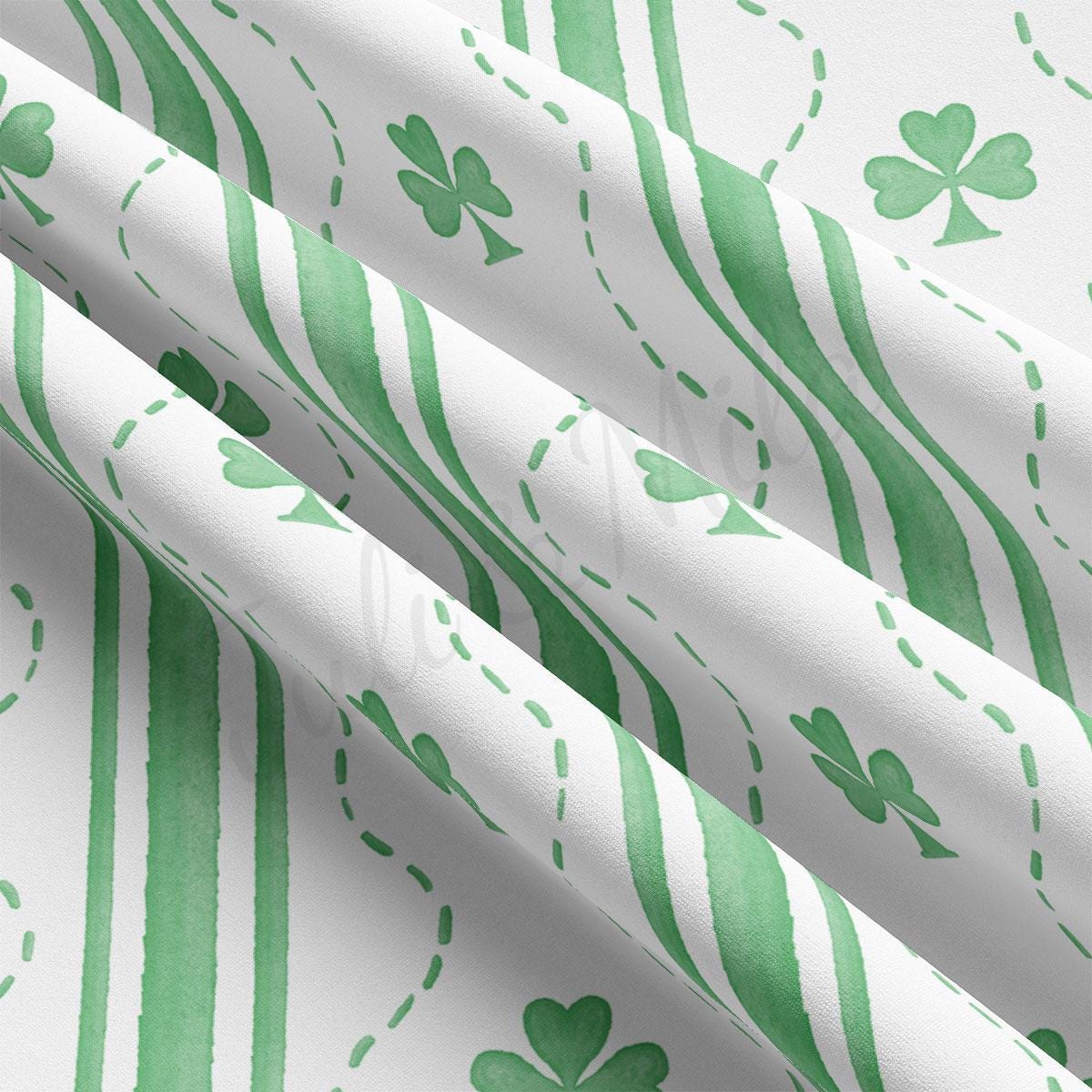 a green and white striped curtain with shamrocks on it