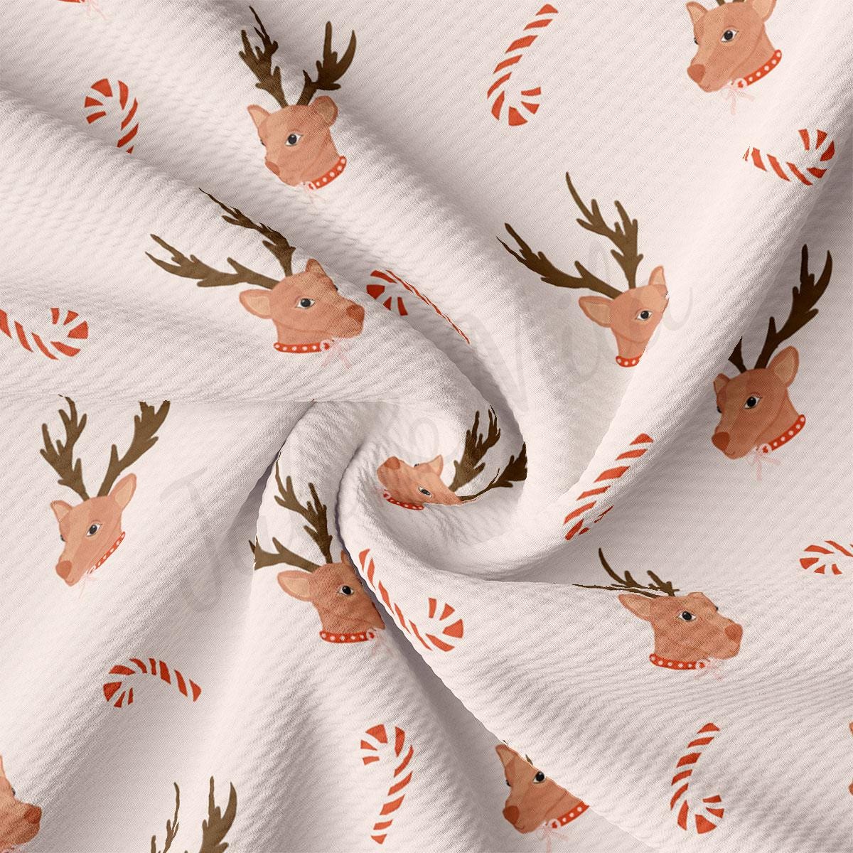 a white fabric with reindeers and candy canes on it