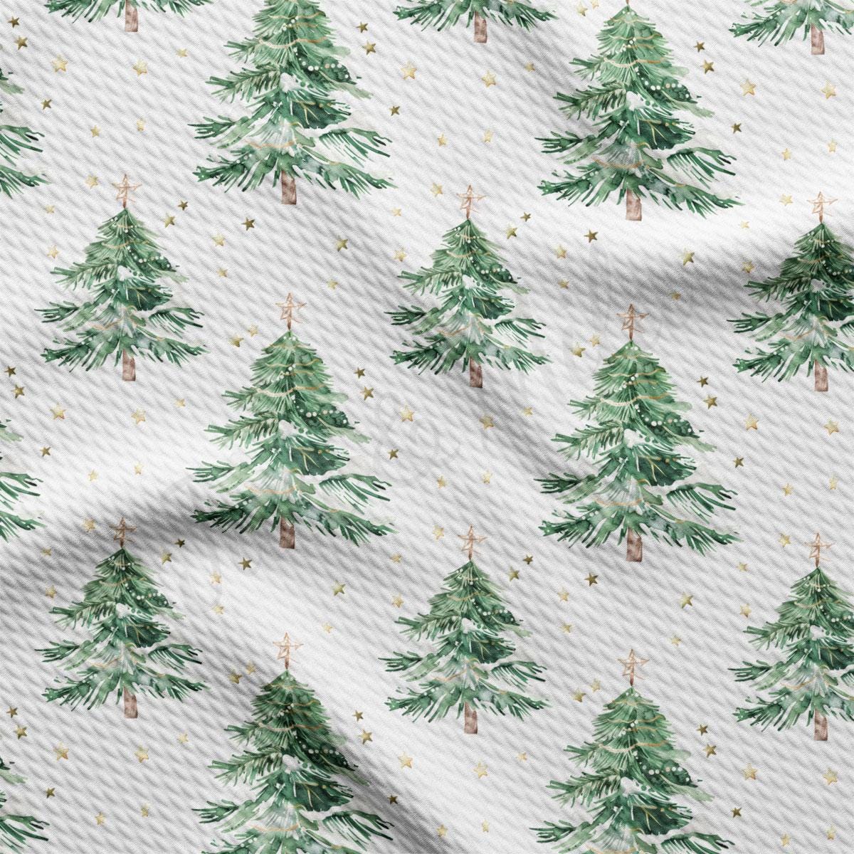 a repeating pattern of green Christmas trees with gold stars scattered throughout the background.
