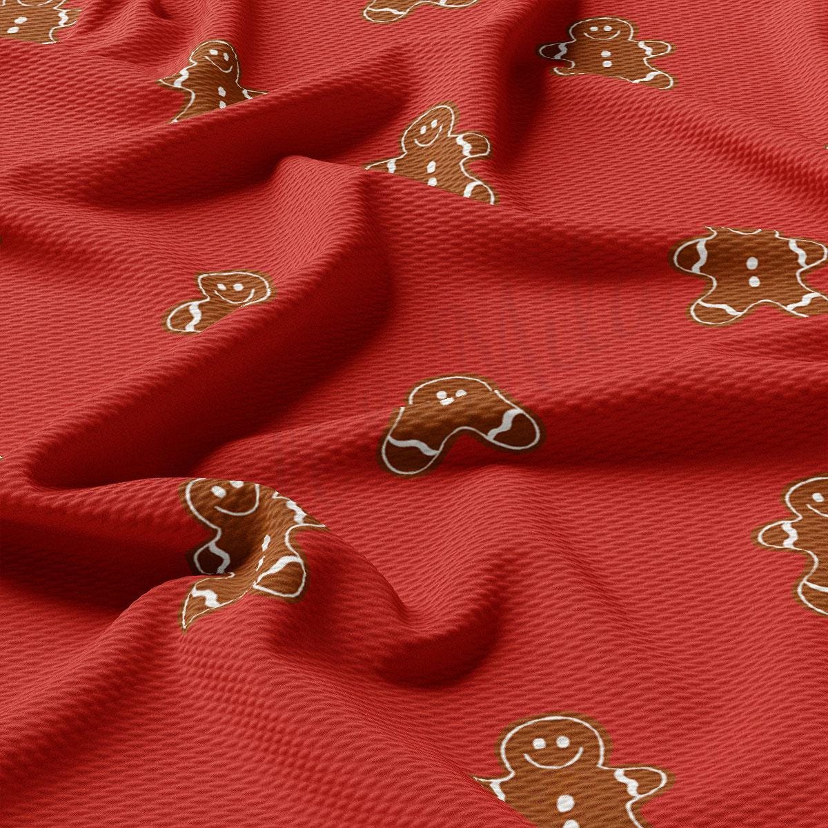 a red fabric with ginger cookies on it