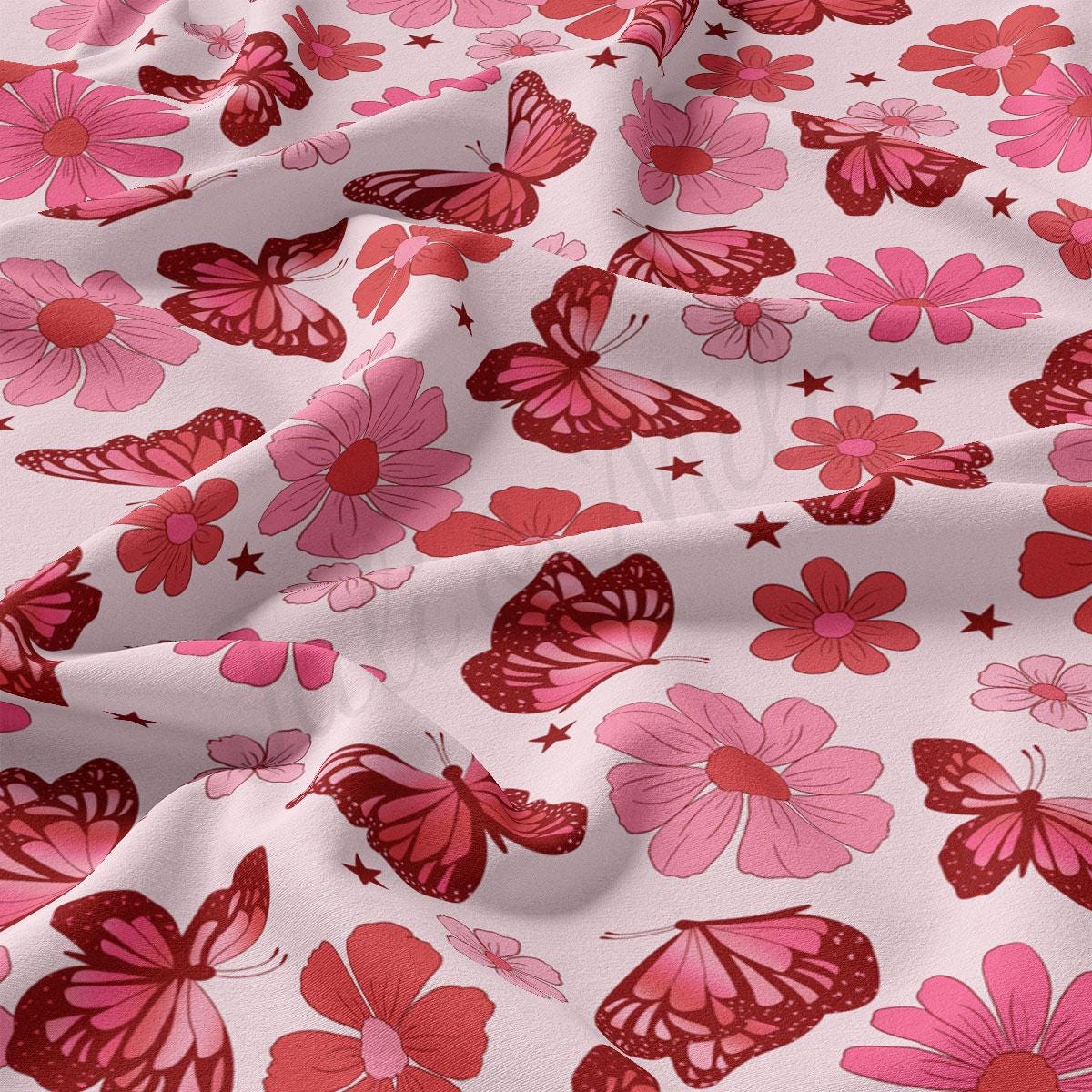 a pink and red flower and butterfly print fabric
