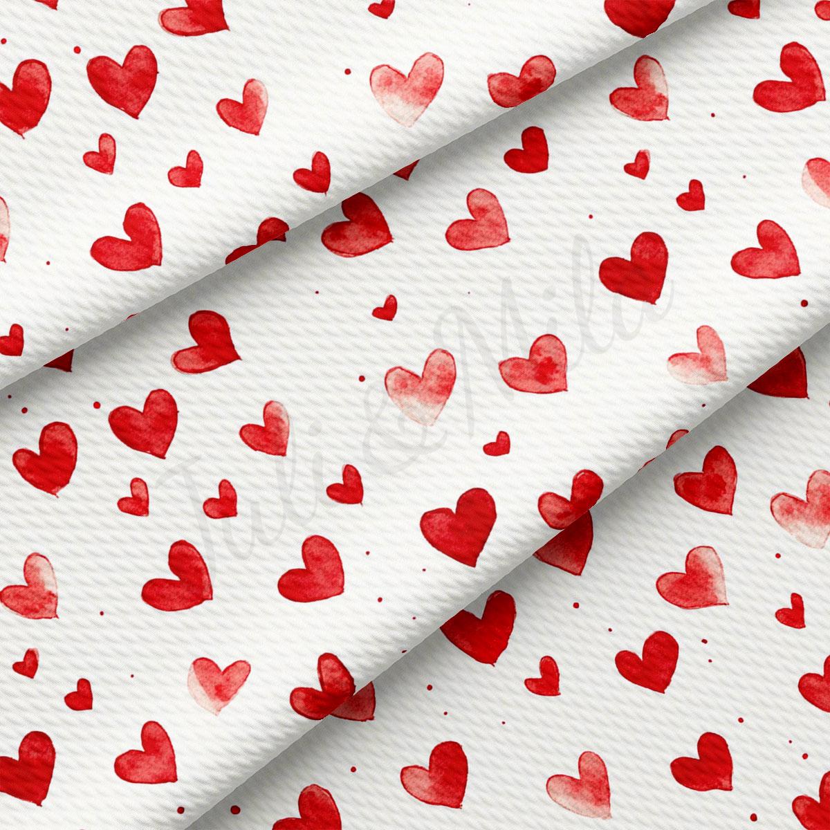 a repeating pattern of red hearts on a white background.