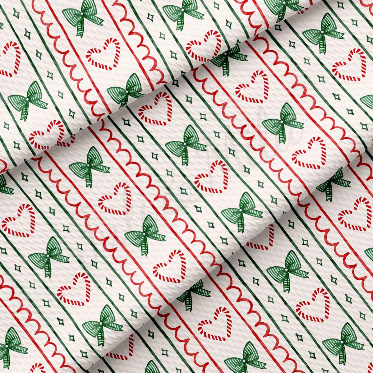 a repeating pattern of green and red bows, heart shapes, and candy cane shapes on a white background.