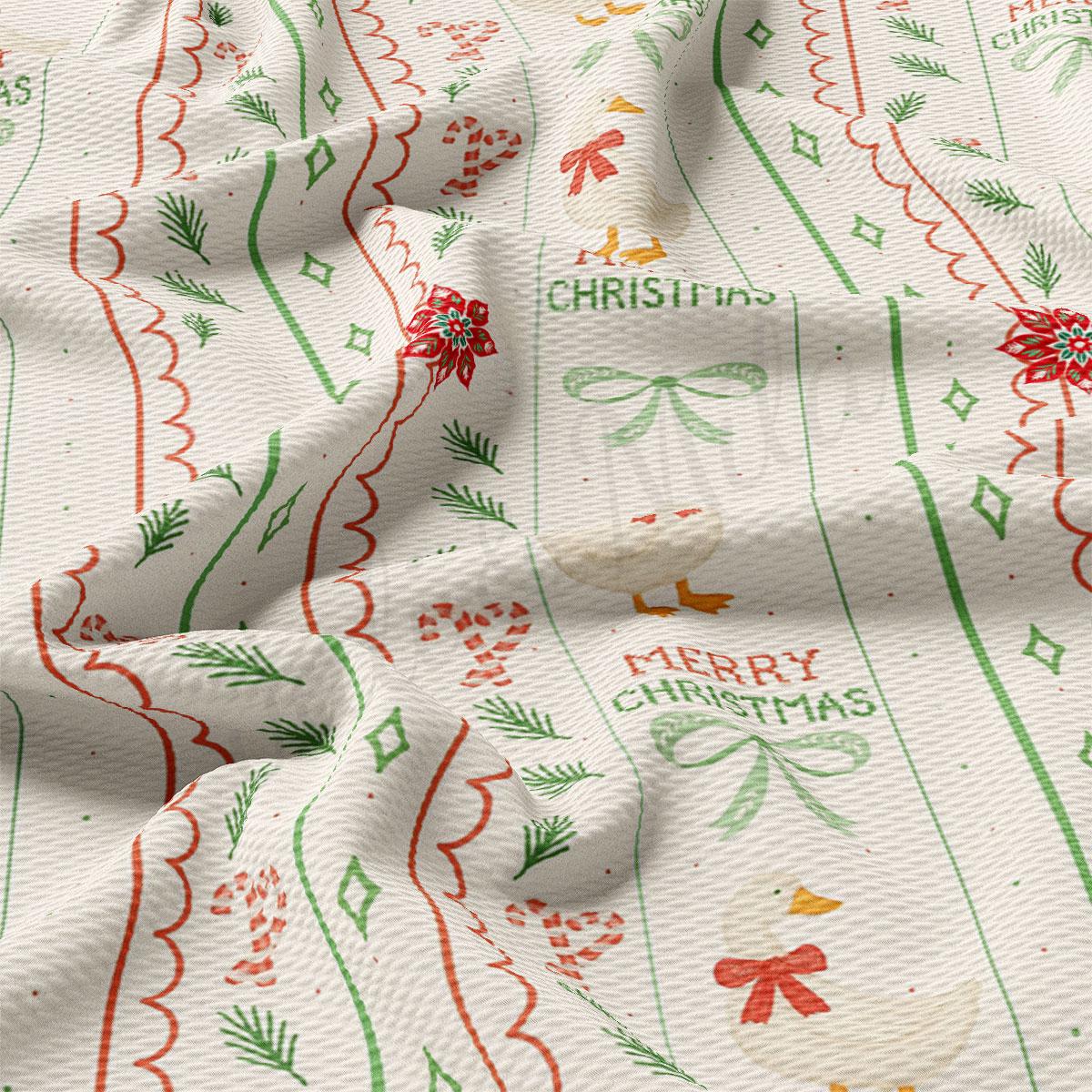 The image is a close-up of a fabric with a Christmas-themed pattern, featuring various designs such as flowers, ribbons, and a duck. The text "Merry Christmas" is visible, suggesting a festive or holiday-themed design.