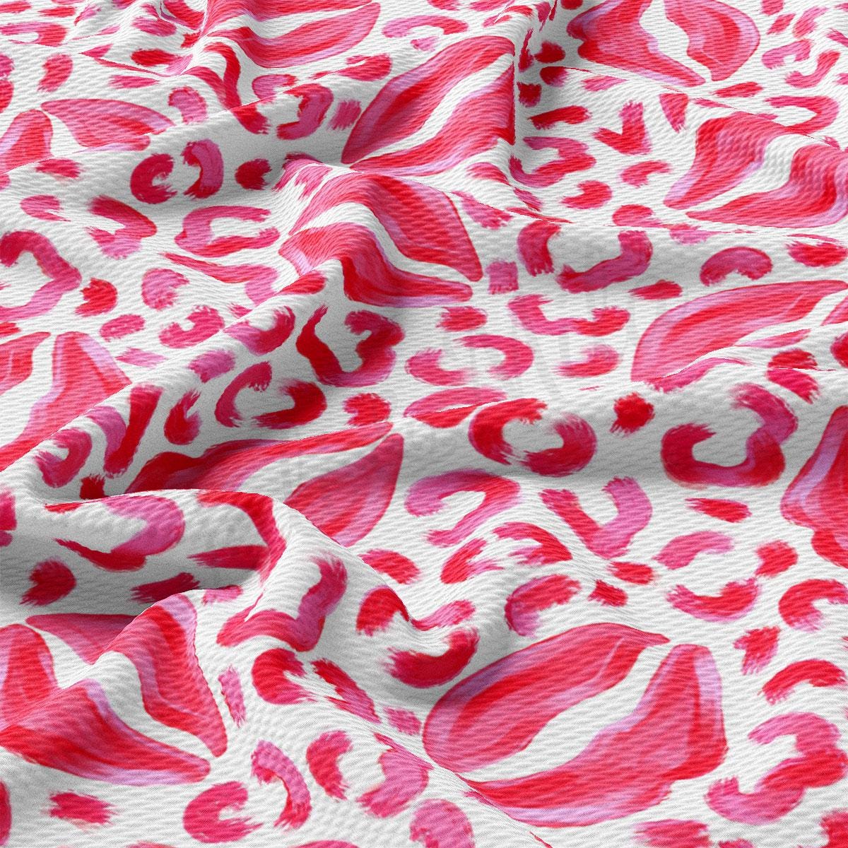a pink and white animal print fabric